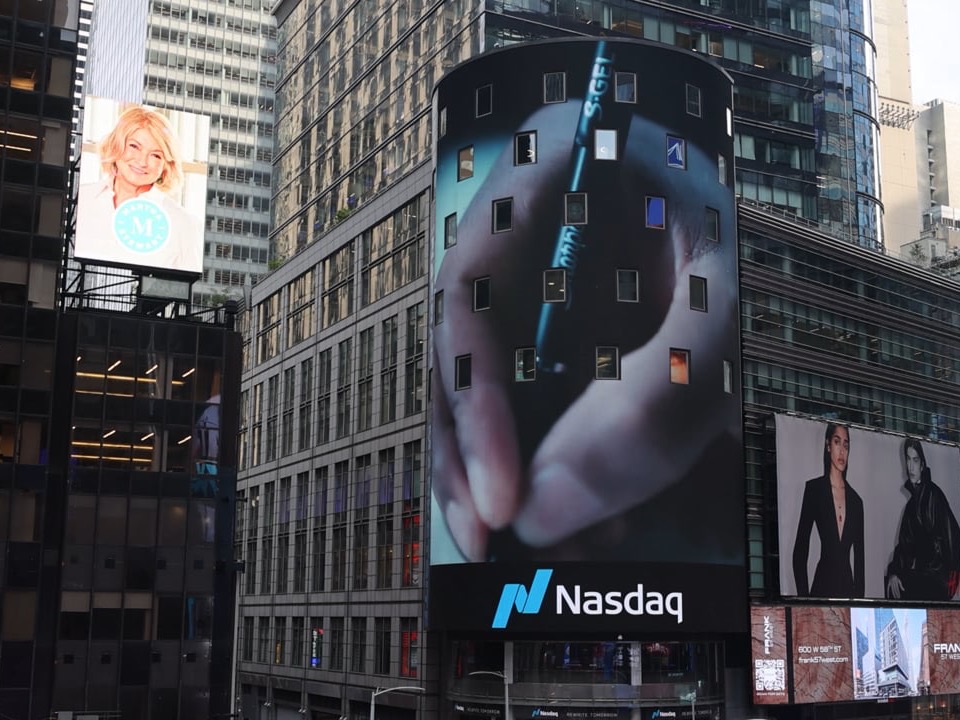 The Sharpie Rookie of the Year spot on the Nasdaq Tower screen in Times Square, a hand holding a Sharpie S-Gel pen filling the curved screen above the Nasdaq wordmark